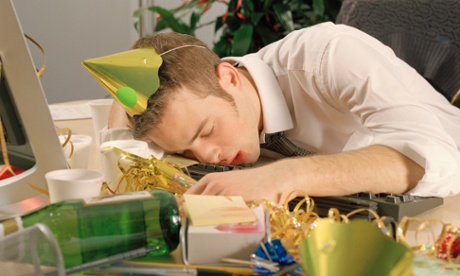 Young man asleep at his desk