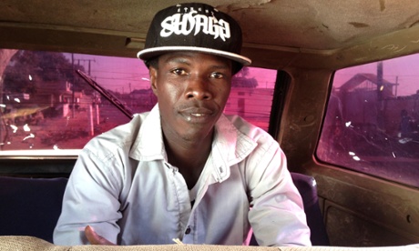 A passenger taking a seven-seater taxi in Senegal