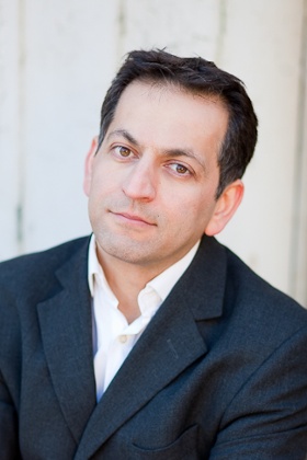 Amir Amirani, director of We Are Many. 