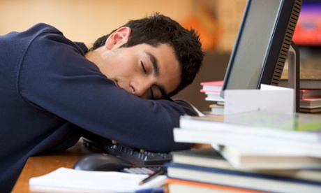 boy sleeping on desk