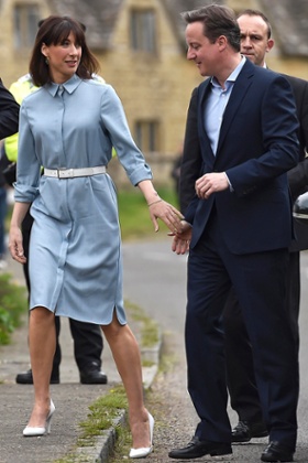 Samantha Cameron wears a pale blue shirt dress to the polling station