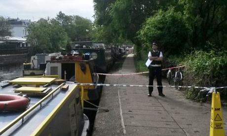 Police at the scene by the Grand Union canal in Little Venice, north-west London, where a woman’s body was found in a suitcase.