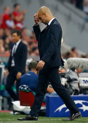 Pep Guardiola has a think about what to do in the second half.
