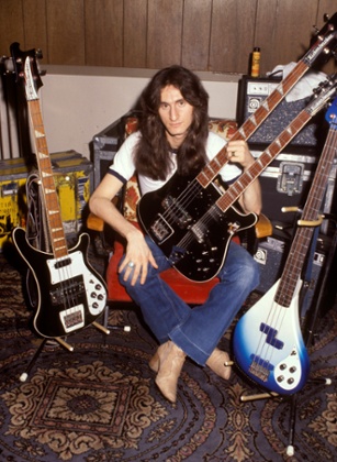 Geddy Lee backstage with his collection of bass guitars