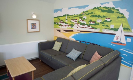 Living area with Minehead Bay mural.