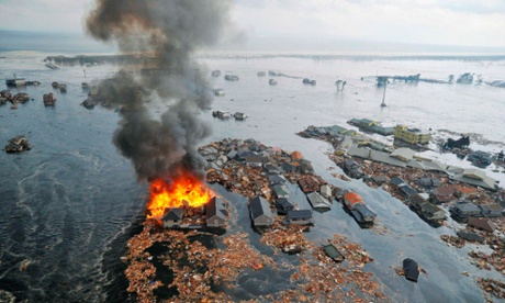 houses submerged in tsunami waves