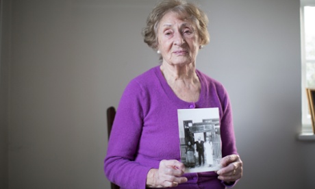Susan Pollack holds a picture of her with her parents, who died during the Holocaust.