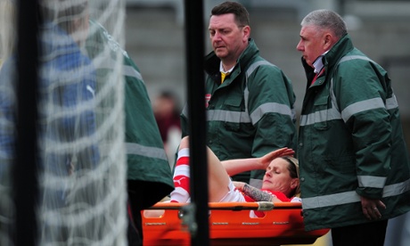 Kelly Smith is taken off on a stretcher - and later underwent ankle surgery.