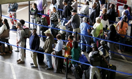 Commuters wait to board Greyhound bus en route to New York City at Union station in Washington