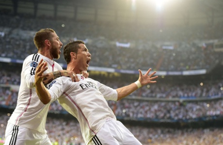 Cristiano Ronaldo celebrates with Sergio Ramos after scoring the opening goal from the spot.