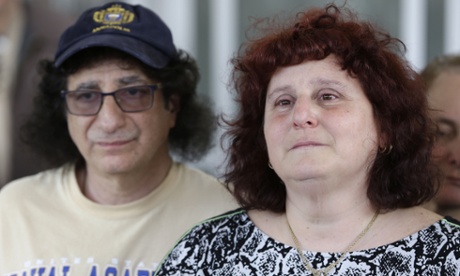 Susan and Howard Zemser, the parents of U.S. Naval Academy Midshipman Justin Zemser, speak to the media outside their home in New York, Wednesday, May 13, 2015. Zemser, 20, who was on leave and heading home to Rockaway Beach, New York, was killed when an Amtrak passenger train derailed and overturned in Philadelphia on the nation's busiest rail corridor Tuesday night.  (AP Photo/Seth Wenig)