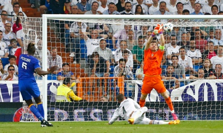 Iker Casillas saves from Juventus' Paul Pogba.
