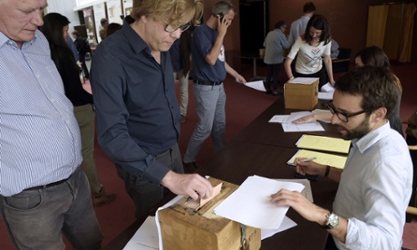 Le Monde journalists cast their votes at the newspaper's headquarters in Paris.
