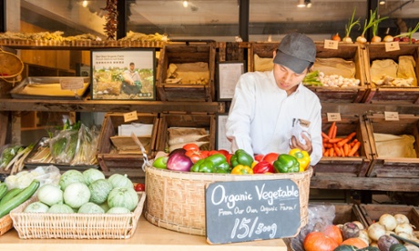 Chinese man selling organic vegetables