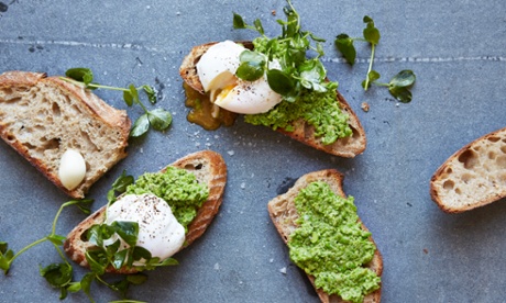 Smashed peas and parmesan on toast with poached egg and pea shoots