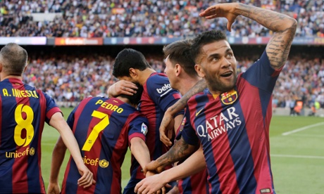 Dani Alves celebrates Pedro's goal against Real Sociedad in a win that helped Barcelona move four points clear of Real Madrid.