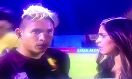 Aquiles Ocanto was giving a live TV interview when he was kicked by a fan.