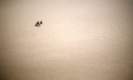 People enjoy the expanse of Blackpool beach as sunshine and warm weather greets visitors to Blackpool Promenade on June 3, 2013 in Blackpool, England. 
