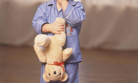 Young boy holding a teddy bear