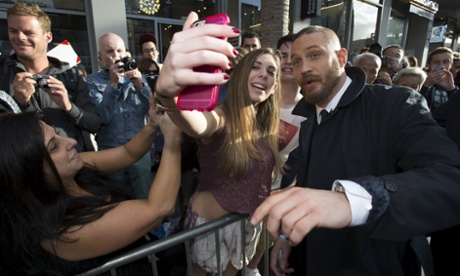 Tom Hardy breaking the Cannes law with a fan last night.