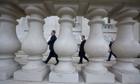 People going to work in traditional clothing, who may be civil servants, Whitehall, London.