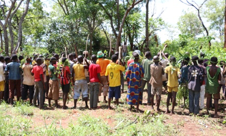 Children associated with the anti-Balaka militia gather around the militia's leaders before a release ceremony in in Bambari in the Central African Republic