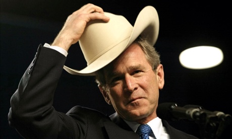 George W. Bush dons a cowboy hat as he speaks at the annual meeting of the cattle industry in 2002.