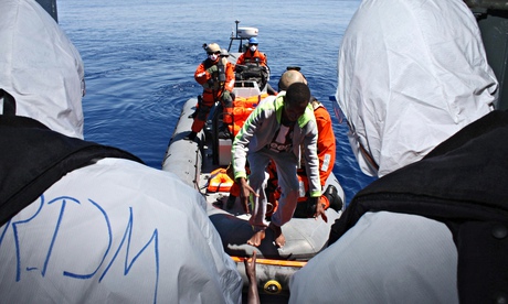 Migrants boarding the German navy's frigate Hessen in the Mediterranean off the Libya coast.