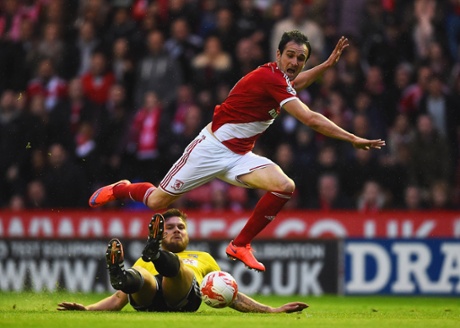 Harlee Dean tackles Enrique Garcia Kike.