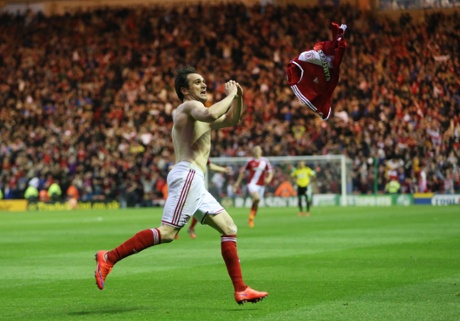 Kike throws his shirt as he celebrates scoring the second.