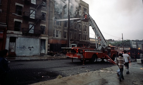 USA, SOUTH BRONX, NEW YORK CITY-AUGUST 1977. New York City Fire Department appliance tackling fire in abandoned tenemant block in South Bronx.