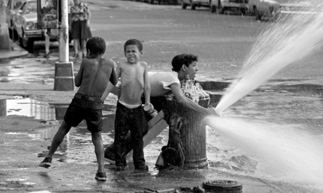 Children cool themselves with a fire hydrant on a hot 1975 summer’s day in New York’s Lower East Side.
