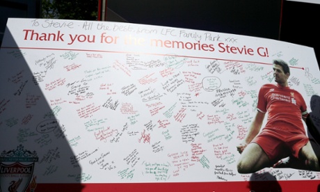 Fans sign and take photographs of a Steven Gerrard thank-you board.