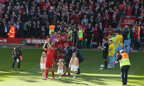Liverpool's Steven Gerrard applauds the Anfield crowd as he is greeted by a guard of honour.