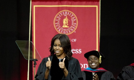 First lady Michelle Obama gives a thumbs up just before delivering the commencement address at Tuskegee University.