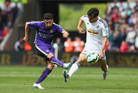 Jesus Navas takes a shot as Ashley Richards closes.