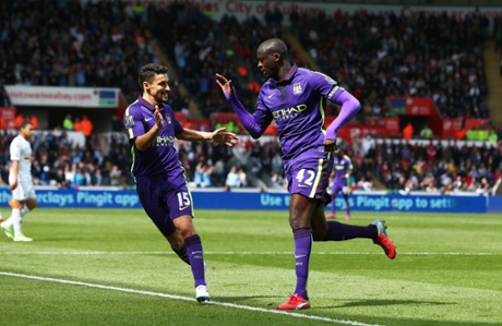 Toure congratulated by teammate Navas.