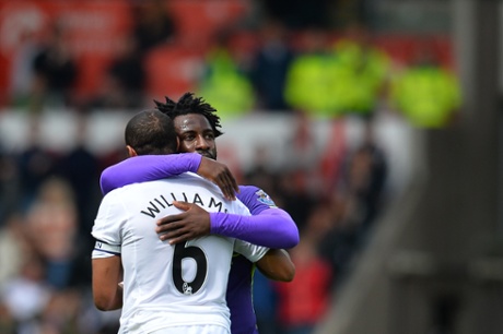 Wilfried Bony embraces former team-mate Ashley Williams.