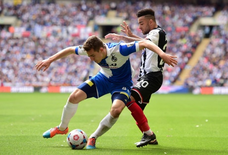 Tom Lockyer holds off Nathan Arnold.