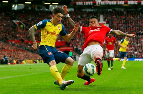 Hector Bellerin under pressure from Marcos Rojo.