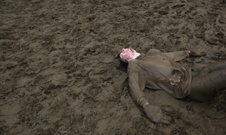 A collapsed and rather tired looking runner at a Tough Guy race