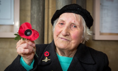 Olive Cooke holding a poppy