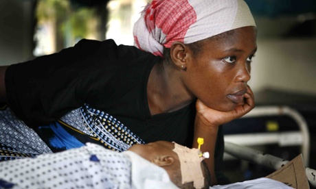 A mother and her newborn baby in the maternity ward of Temeke General Hospital, Dar Es Salaam, Tanzania.