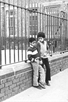 Boys by Windsor Street School railings.