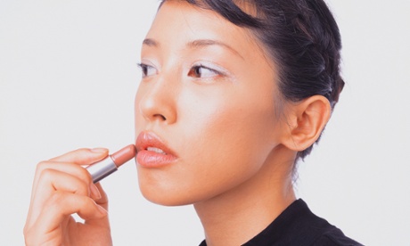 Woman applying makeup
