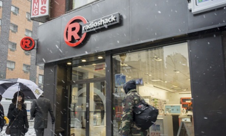 People walk by a New York RadioShack.