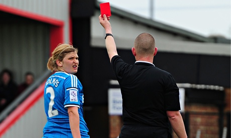 Abby Holmes of Sunderland is shown a red card after her challenge on Kelly Smith of Arsenal
