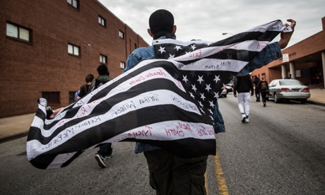 Protesters march through the streets in support of Maryland state attorney Marilyn Mosby’s announcement that charges would be filed against Baltimore police officers in the death of Freddie Gray on 1 May, 2015, in Baltimore, Maryland.