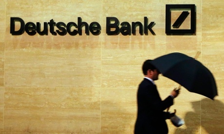 A man walks past Deutsche Bank's offices in London.
