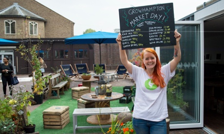 Anthropology student Celia Briseid selling freshly harvested vegetables at Growhampton’s weekly market day.
